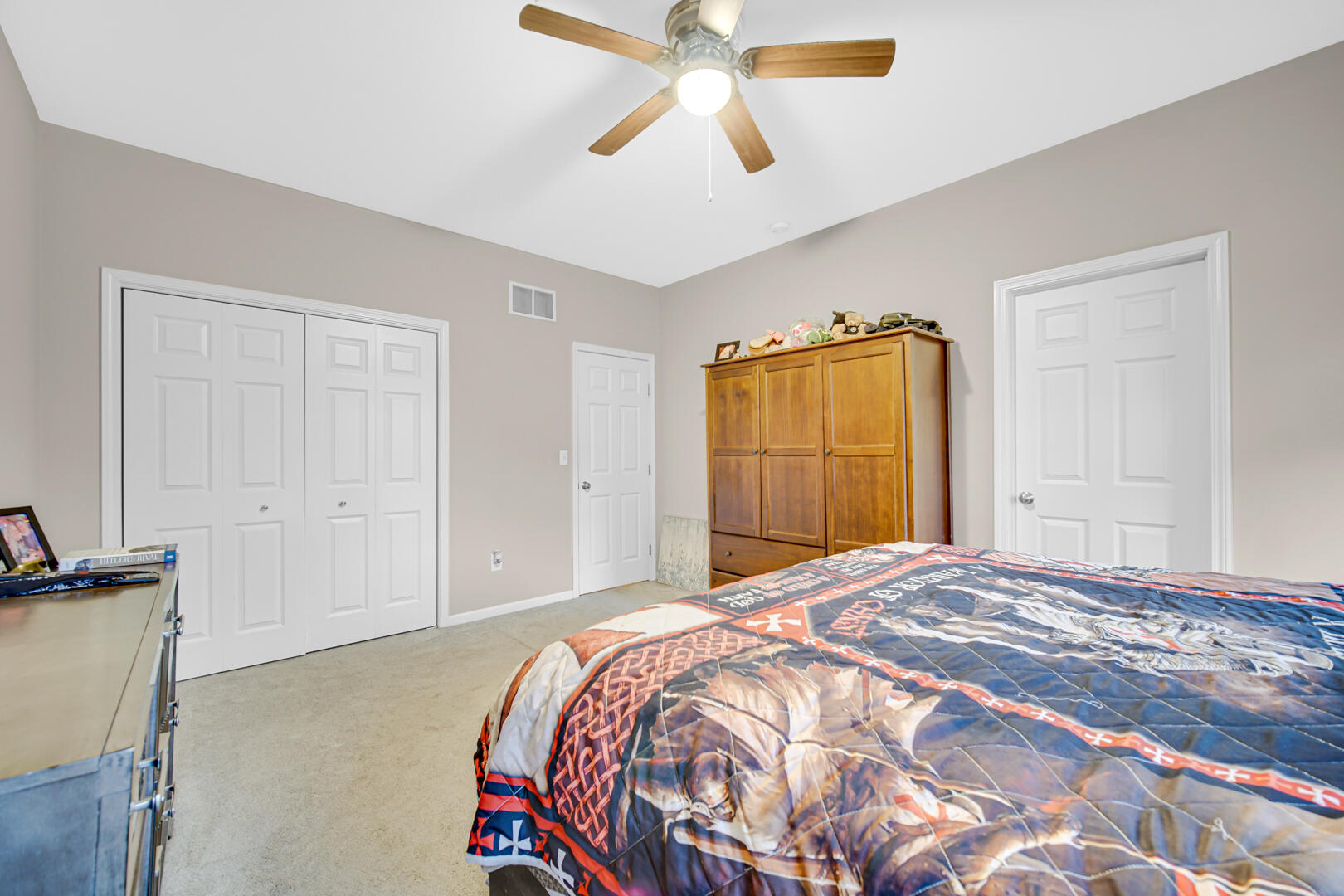 1055 Doe Path Lane Crown Point, IN 46307 - Photo 11 of 26 a bedroom with a bed and a chandelier
