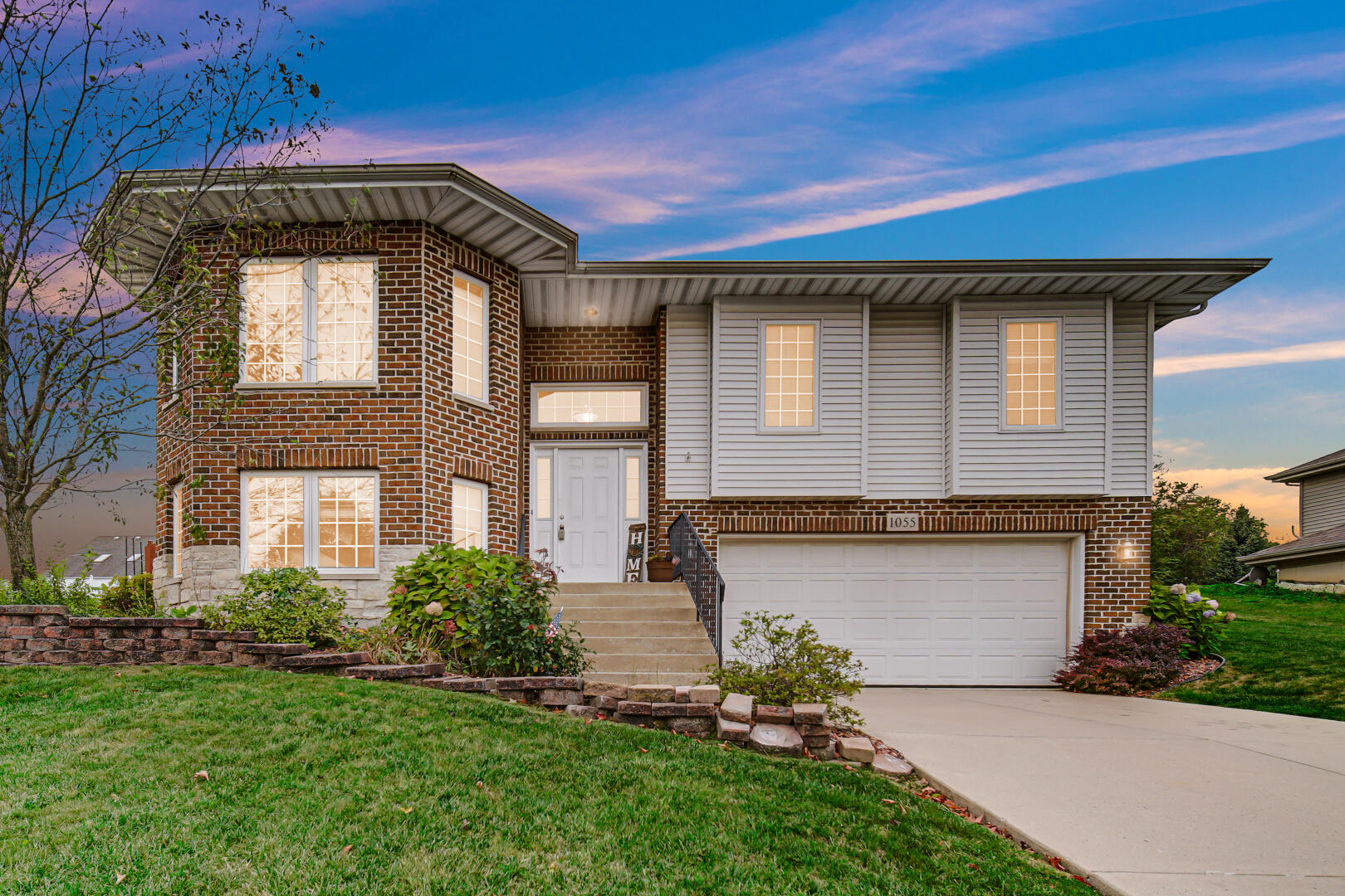 1055 Doe Path Lane Crown Point, IN 46307 - Photo 15 of 26 a front view of a house with garden