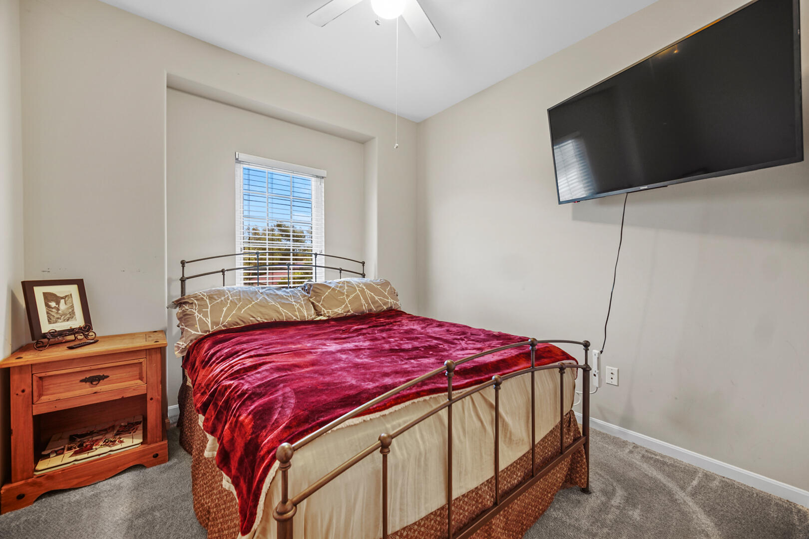 1055 Doe Path Lane Crown Point, IN 46307 - Photo 18 of 26 a bedroom with a bed and a flat tv screen on dresser