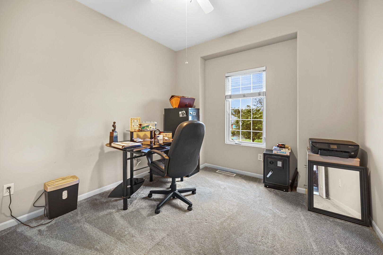 1055 Doe Path Lane Crown Point, IN 46307 - Photo 19 of 26 a view of a workspace with furniture and a window