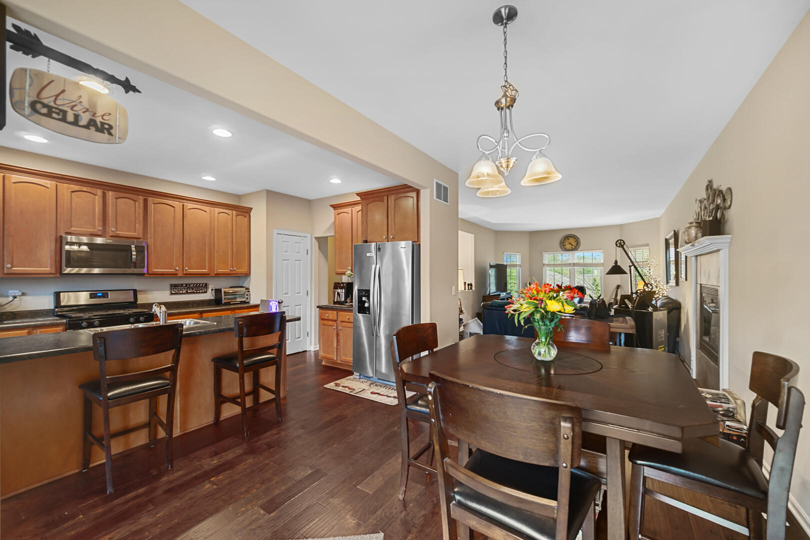 1055 Doe Path Lane Crown Point, IN 46307 - Photo 3 of 26 a view of a dining room with furniture window and wooden floor
