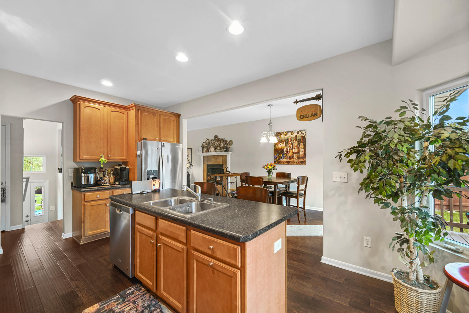 1055 Doe Path Lane Crown Point, IN 46307 - Photo 7 of 26 a kitchen with stainless steel appliances granite countertop a stove a sink and a refrigerator