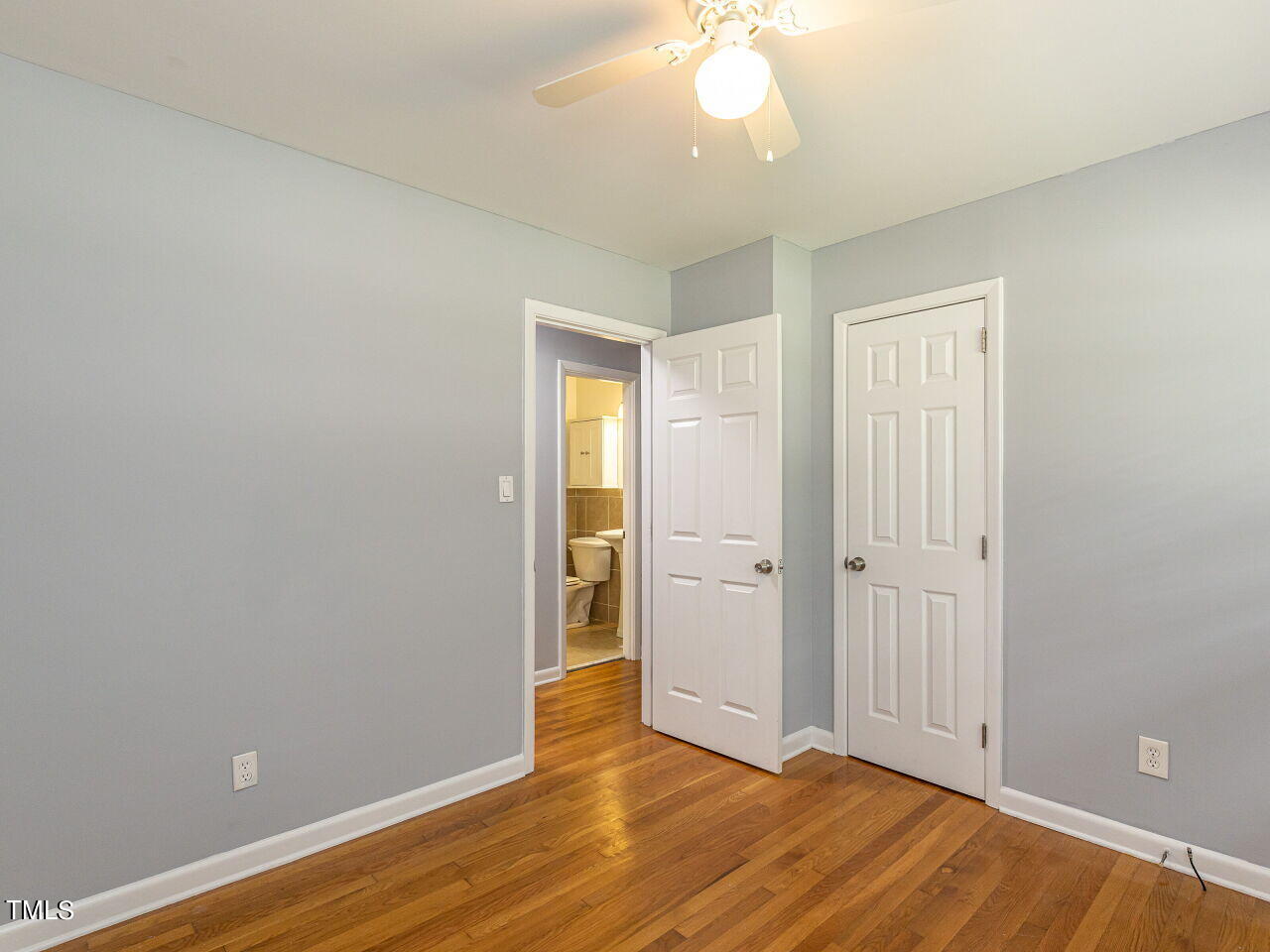 4607 Blanchard Road Durham, NC 27713 - Photo 17 of 31 an empty room with wooden floor and closet area