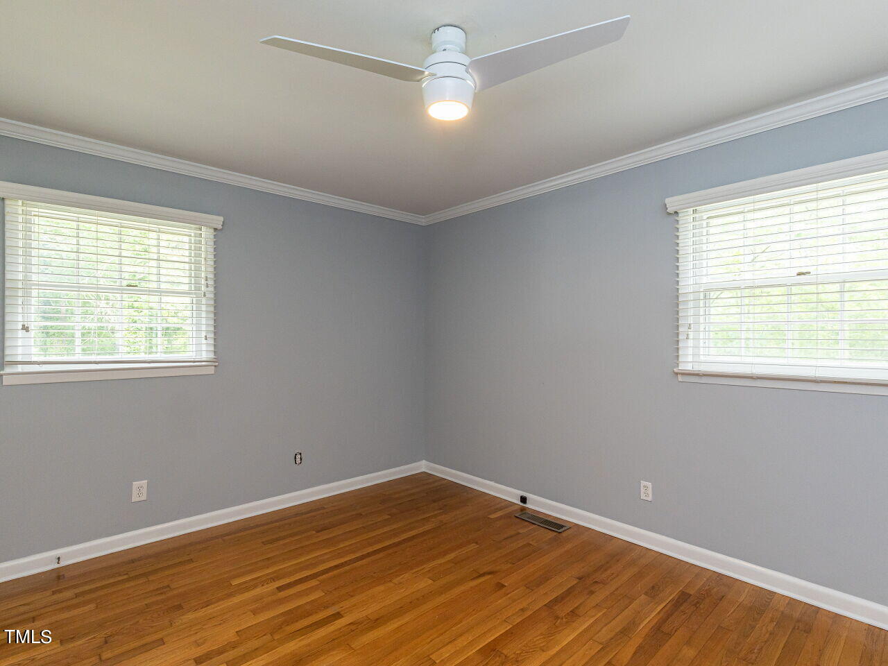 4607 Blanchard Road Durham, NC 27713 - Photo 21 of 31 a view of empty room with wooden floor and fan
