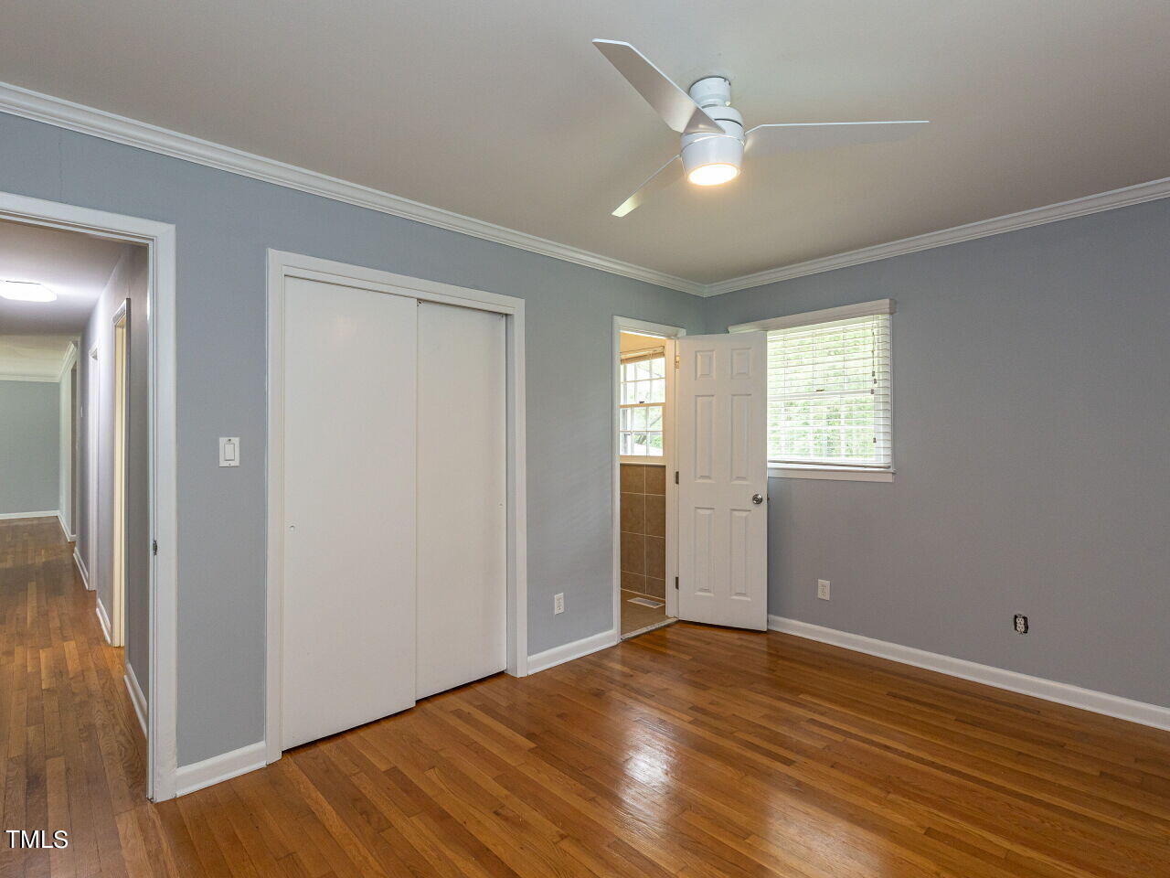4607 Blanchard Road Durham, NC 27713 - Photo 23 of 31 a view of an empty room with wooden floor and a window