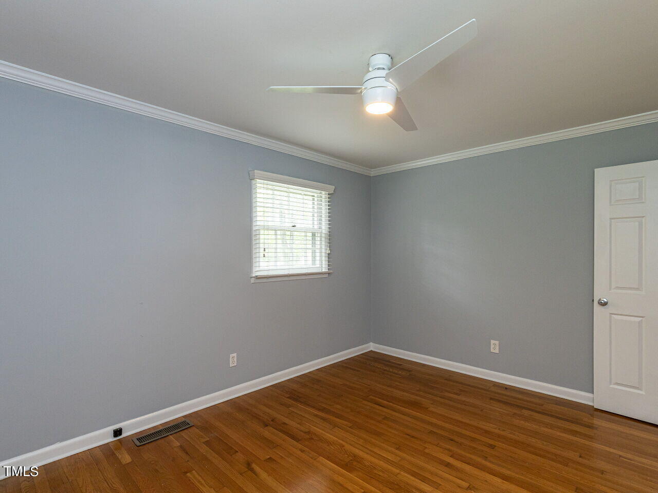 4607 Blanchard Road Durham, NC 27713 - Photo 24 of 31 wooden floor in an empty room with a window