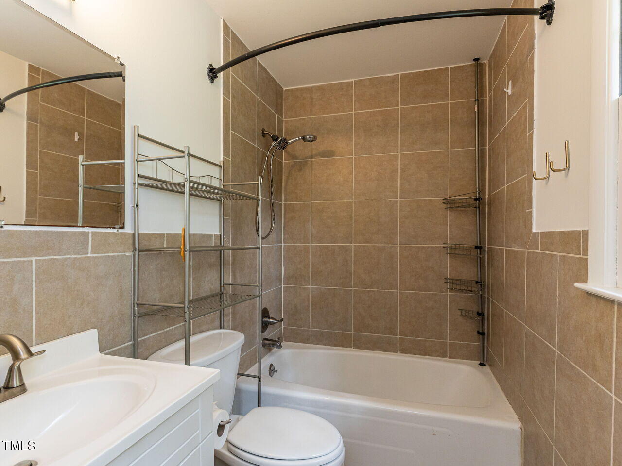 4607 Blanchard Road Durham, NC 27713 - Photo 25 of 31 a bathroom with a bathtub and a sink