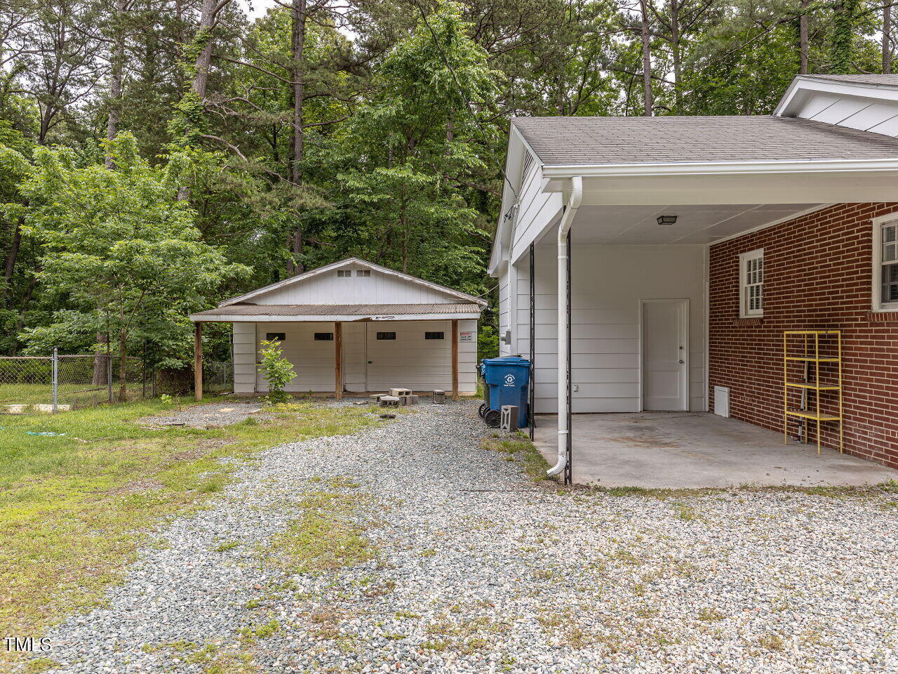 4607 Blanchard Road Durham, NC 27713 - Photo 4 of 31 a front view of a house with garden