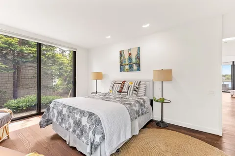 a bedroom with a bed and a lamp