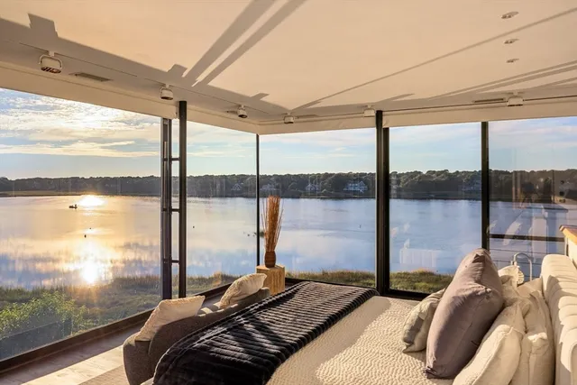 a bedroom with a large window