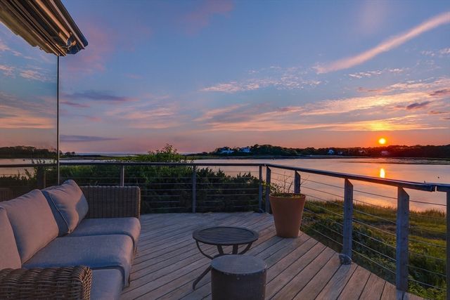 a view of balcony with furniture