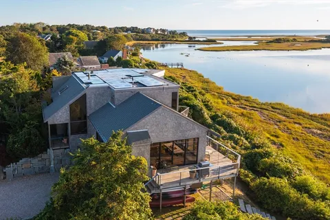 a view of a house with outdoor space and lake view