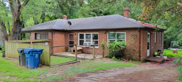 a view of an house with backyard space and garden