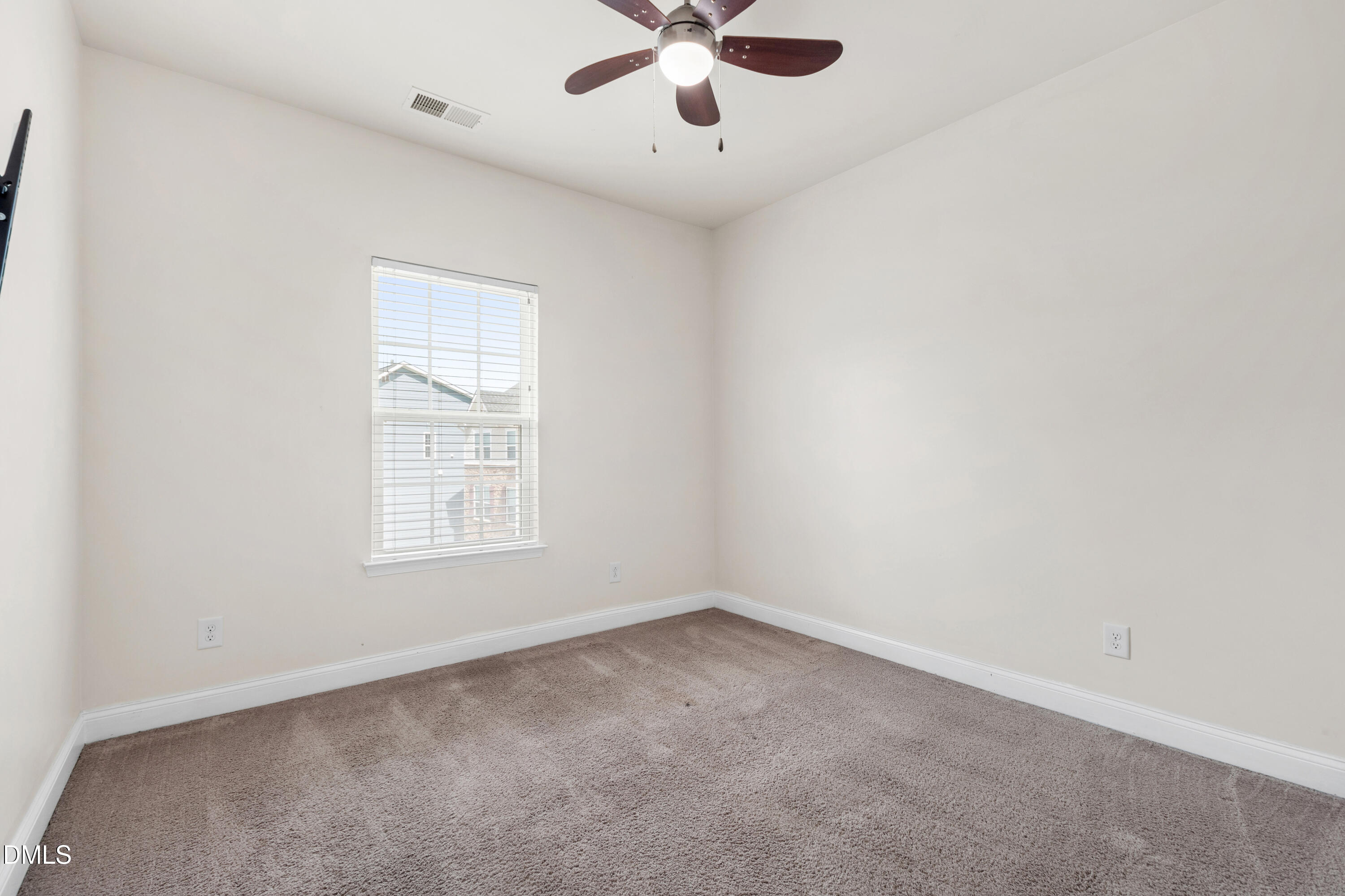 1101 Boxcar Way Apex, NC 27502 - Photo 17 of 27 an empty room with a window and a fan