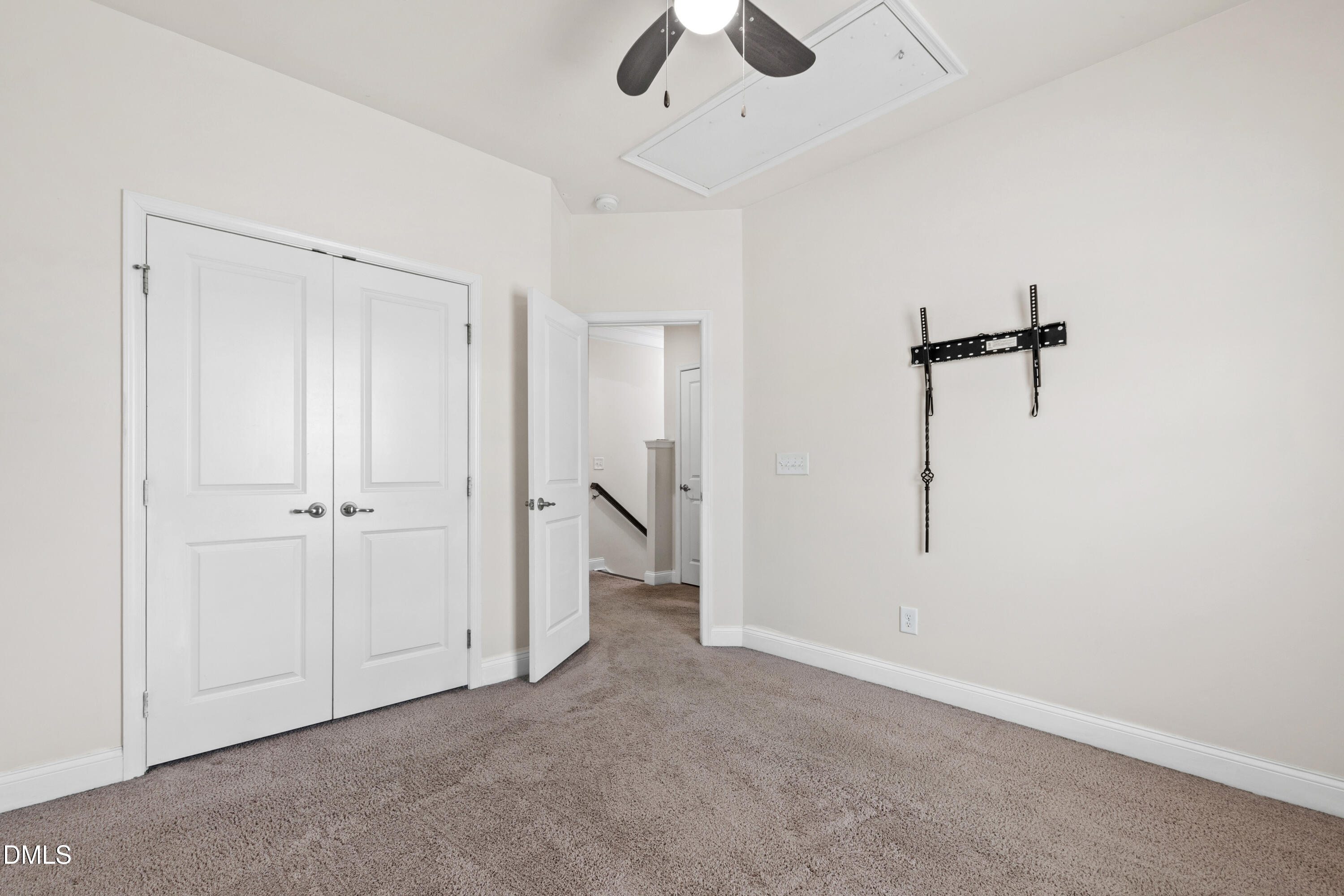 1101 Boxcar Way Apex, NC 27502 - Photo 20 of 27 an empty room with closet and a ceiling fan