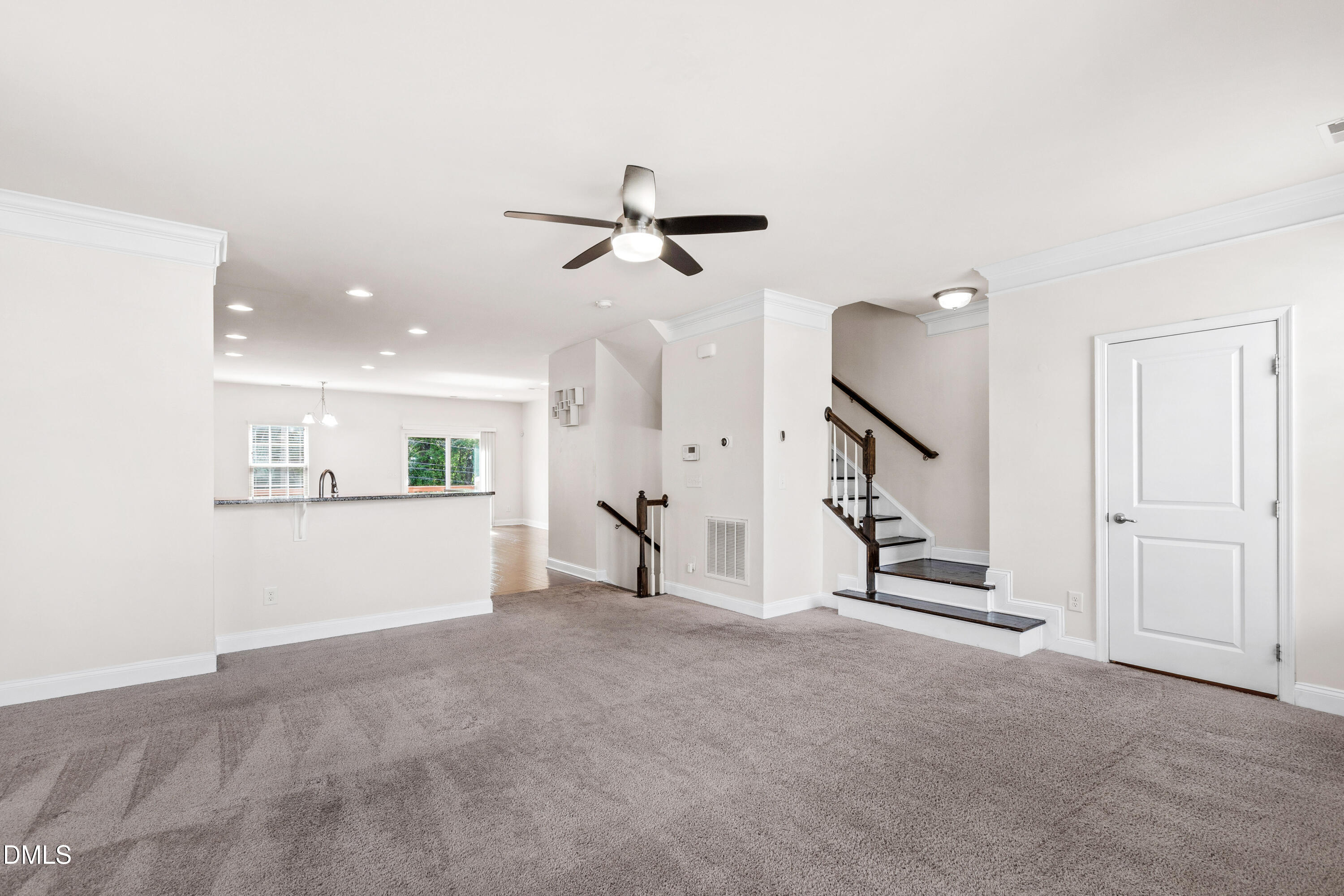 1101 Boxcar Way Apex, NC 27502 - Photo 10 of 27 a view of an empty room with a ceiling fan