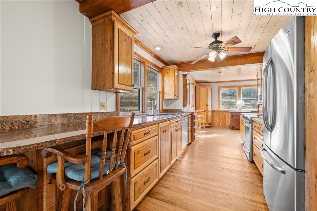 211 Possum Hollow Road Blowing Rock, NC 28605 - Photo 11 of 46 a large white kitchen with a large window