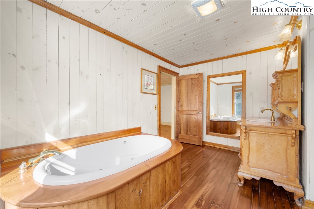 211 Possum Hollow Road Blowing Rock, NC 28605 - Photo 19 of 46 a bathroom with a tub and sink