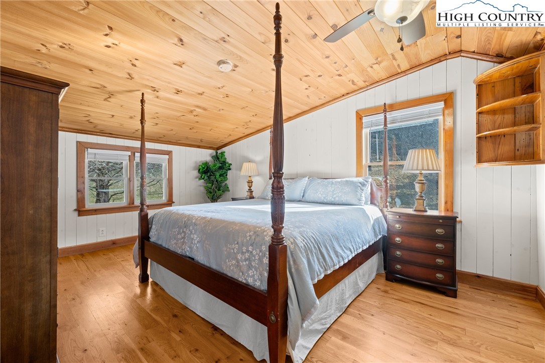 211 Possum Hollow Road Blowing Rock, NC 28605 - Photo 26 of 46 a bed sitting in a spacious bedroom next to a window