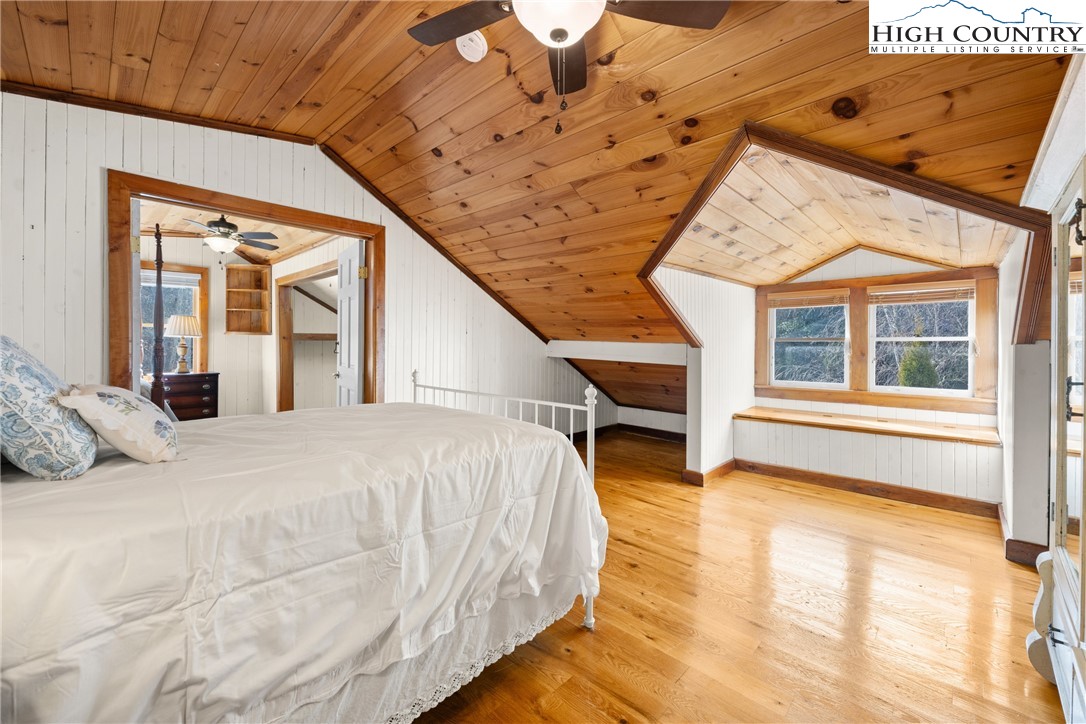 211 Possum Hollow Road Blowing Rock, NC 28605 - Photo 28 of 46 a bedroom with bed and window