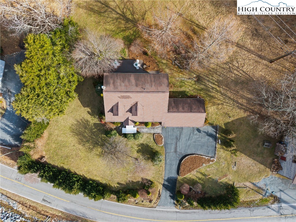 211 Possum Hollow Road Blowing Rock, NC 28605 - Photo 3 of 46 an aerial view of a house with a yard
