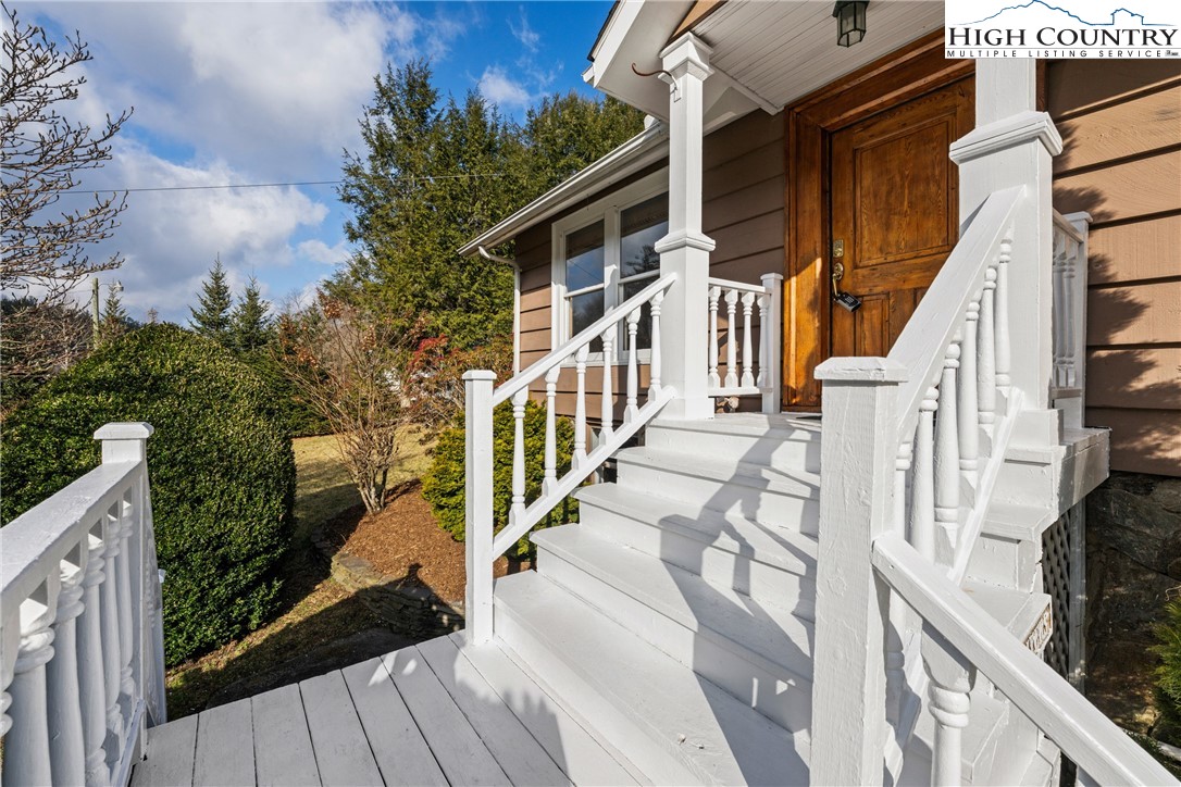 211 Possum Hollow Road Blowing Rock, NC 28605 - Photo 6 of 46 a view of a house with wooden floor and iron fence