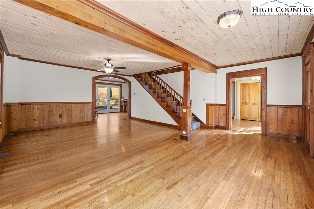 211 Possum Hollow Road Blowing Rock, NC 28605 - Photo 7 of 46 a view of an empty room with wooden floor and stairs