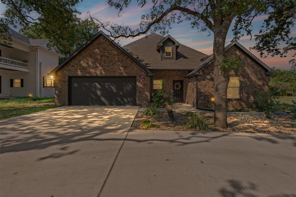 204 West 5th Street Springtown, TX 76082 - Photo 2 of 28 a view of a house with backyard