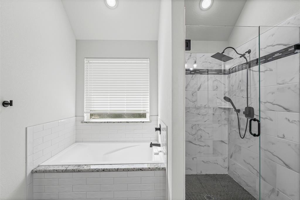 204 West 5th Street Springtown, TX 76082 - Photo 23 of 28 a bathroom with a bathtub and shower