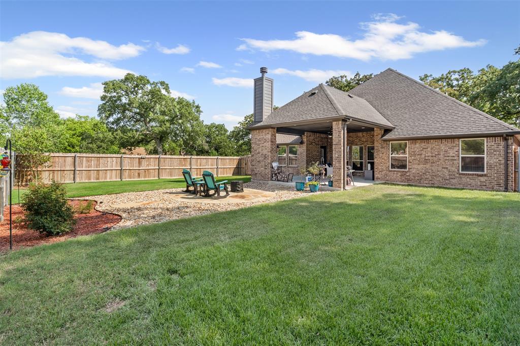 204 West 5th Street Springtown, TX 76082 - Photo 27 of 28 a view of a house with a yard
