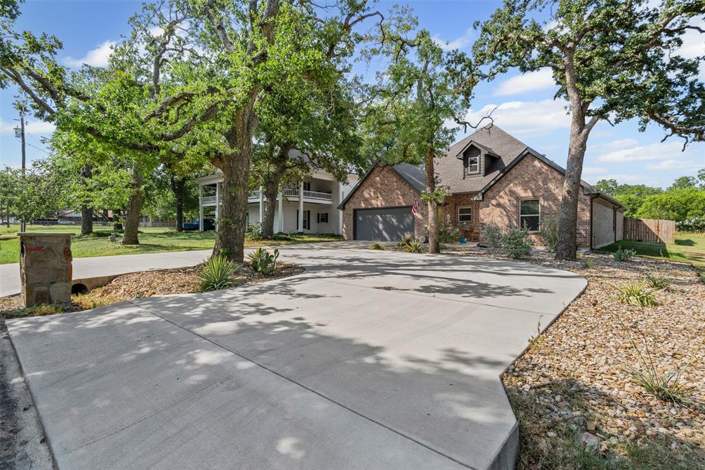 204 West 5th Street Springtown, TX 76082 - Photo 5 of 28 a view of a house with a yard