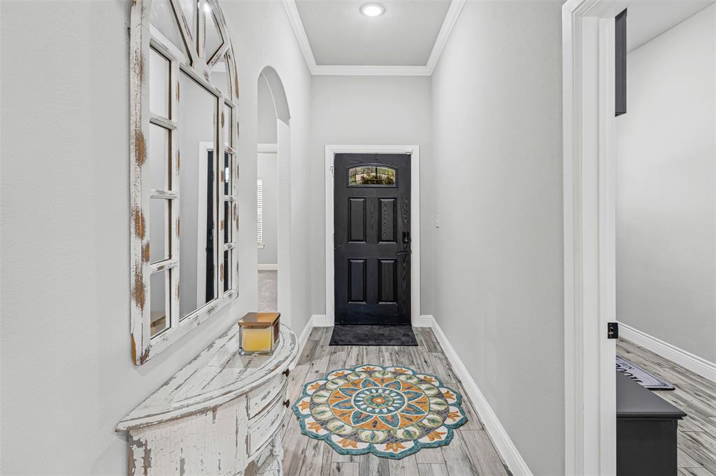 204 West 5th Street Springtown, TX 76082 - Photo 7 of 28 a view of an entryway with staircase