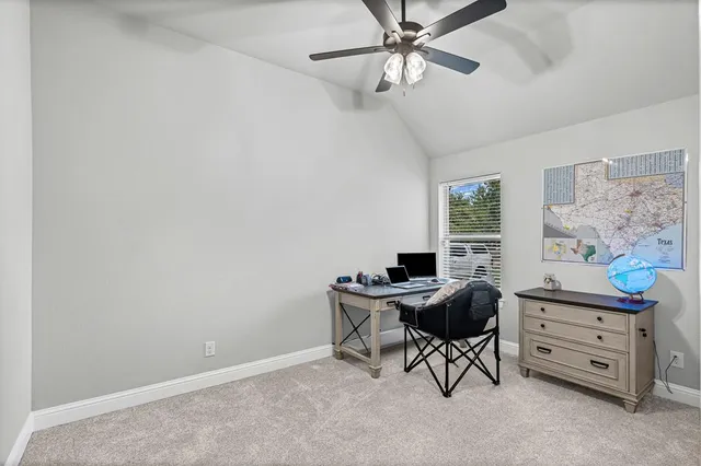 a workspace with furniture and a window