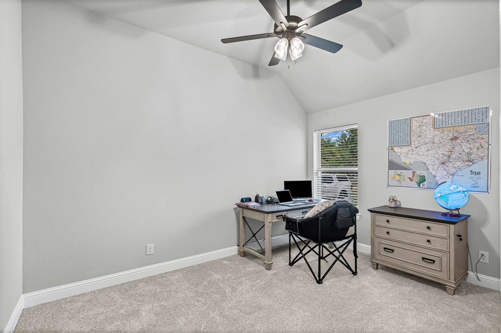 204 West 5th Street Springtown, TX 76082 - Photo 10 of 28 a workspace with furniture and a window