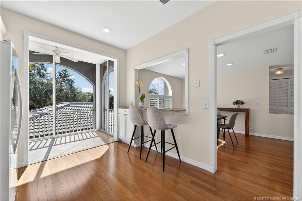 12400 Harbour Ridge Boulevard, Unit 58 Palm City, FL 34990 - Photo 19 of 42 a view of a livingroom with furniture wooden floor and windows