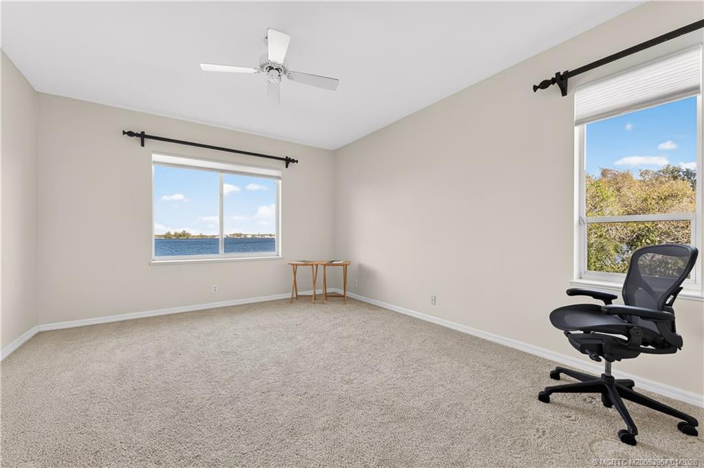 12400 Harbour Ridge Boulevard, Unit 58 Palm City, FL 34990 - Photo 21 of 42 a view of room with window and a ceiling fan