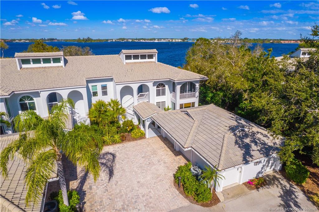 12400 Harbour Ridge Boulevard, Unit 58 Palm City, FL 34990 - Photo 33 of 42 a aerial view of a house with a yard and potted plants