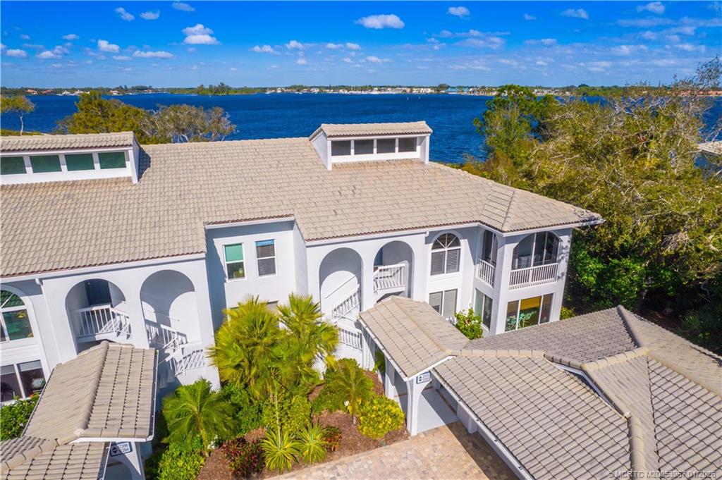 12400 Harbour Ridge Boulevard, Unit 58 Palm City, FL 34990 - Photo 34 of 42 a front view of a house with garden