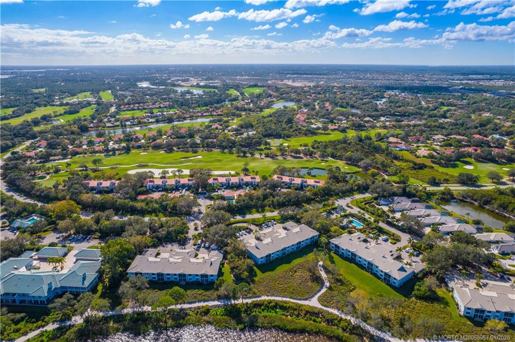 12400 Harbour Ridge Boulevard, Unit 58 Palm City, FL 34990 - Photo 40 of 42 an aerial view of residential houses with outdoor space
