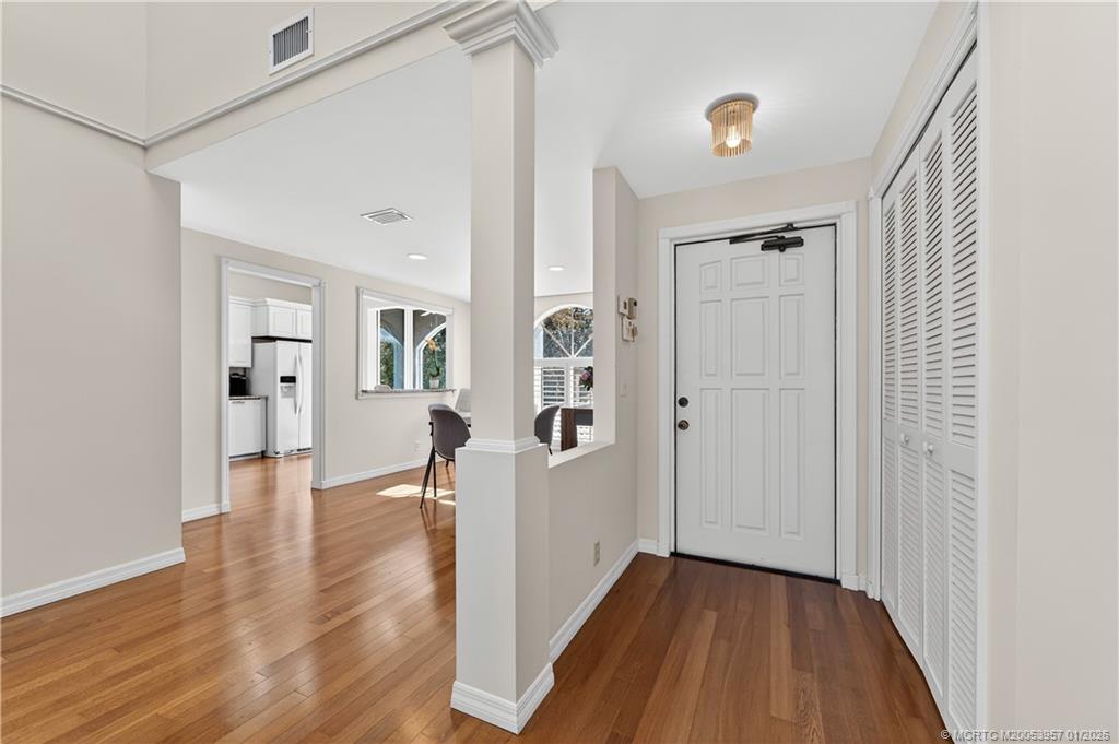12400 Harbour Ridge Boulevard, Unit 58 Palm City, FL 34990 - Photo 5 of 42 a view of a hallway with wooden floor and closet area