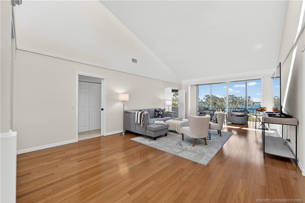 12400 Harbour Ridge Boulevard, Unit 58 Palm City, FL 34990 - Photo 6 of 42 a living room with furniture and a large window