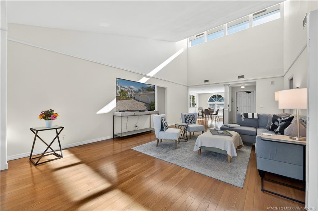 12400 Harbour Ridge Boulevard, Unit 58 Palm City, FL 34990 - Photo 8 of 42 a living room with furniture and a wooden floor