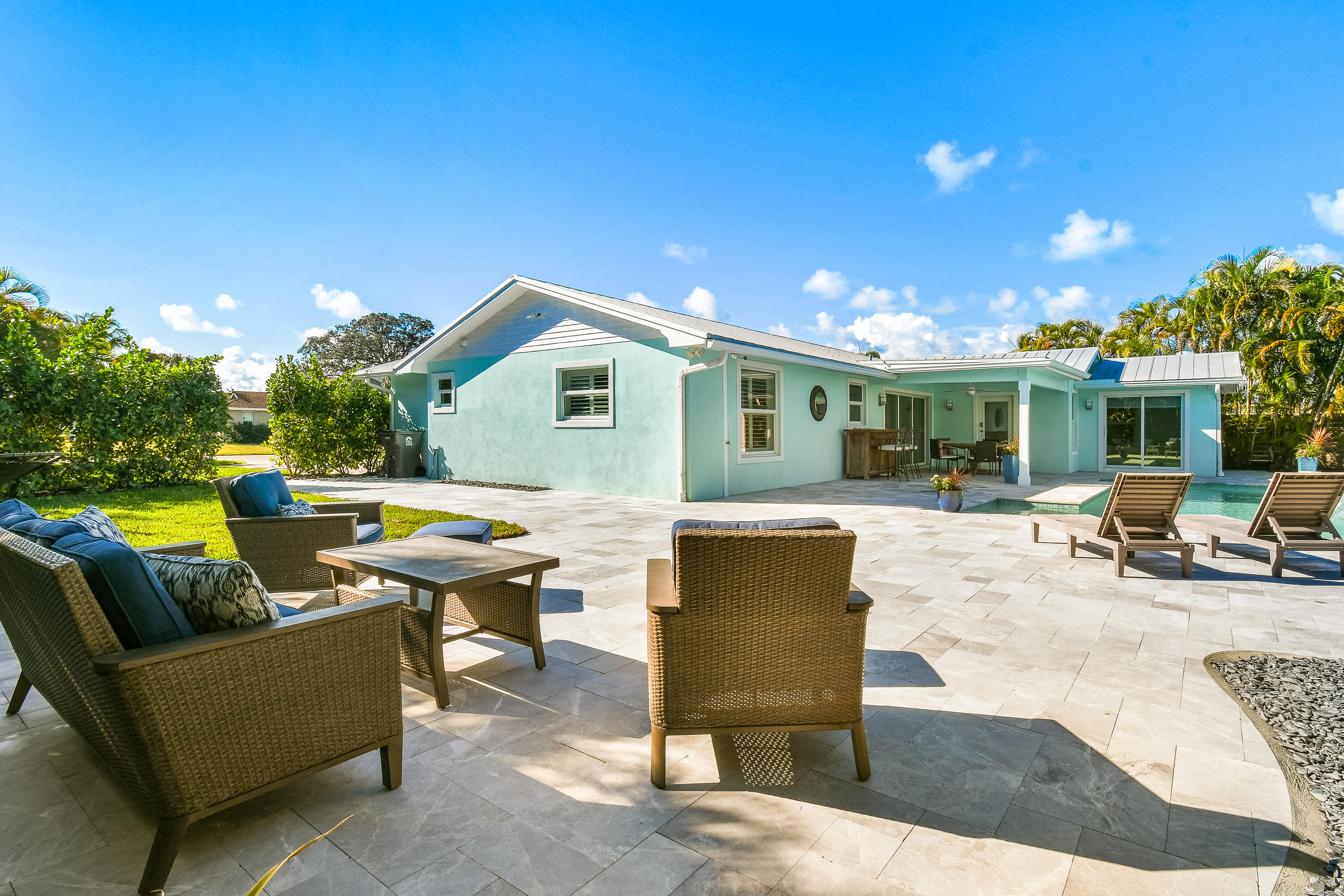 4835 Bimini Road Jupiter, FL 33469 - Photo 13 of 37 a view of a house with swimming pool and sitting area