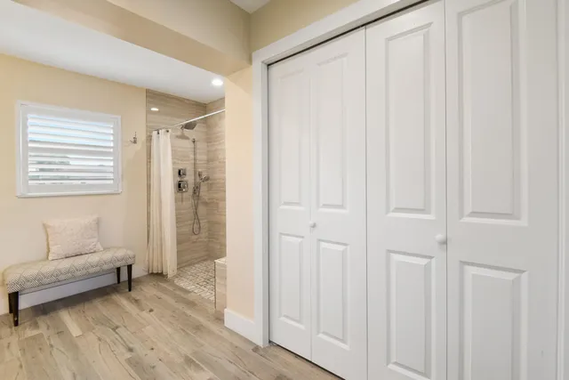 a view of a livingroom with furniture and hardwood floor