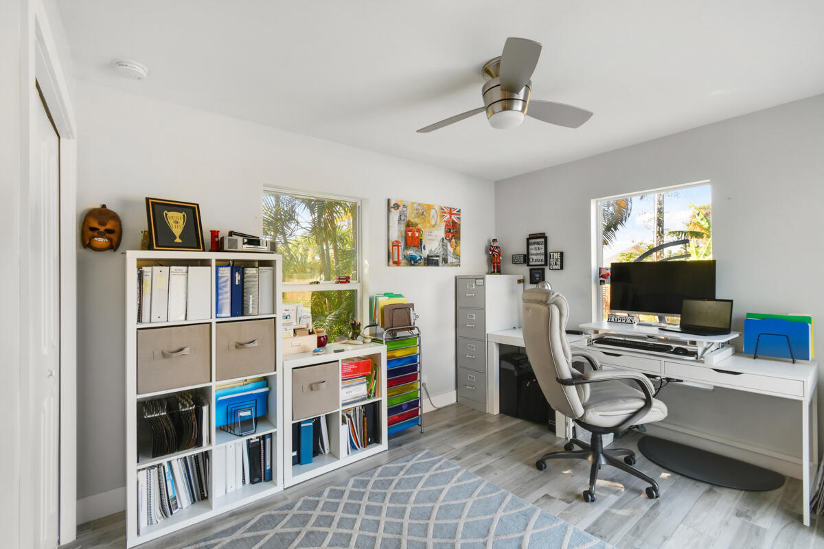 4835 Bimini Road Jupiter, FL 33469 - Photo 29 of 37 a view of a workspace with furniture and a window