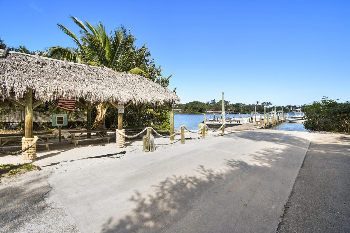 4835 Bimini Road Jupiter, FL 33469 - Photo 33 of 37 a view of a swimming pool with a patio