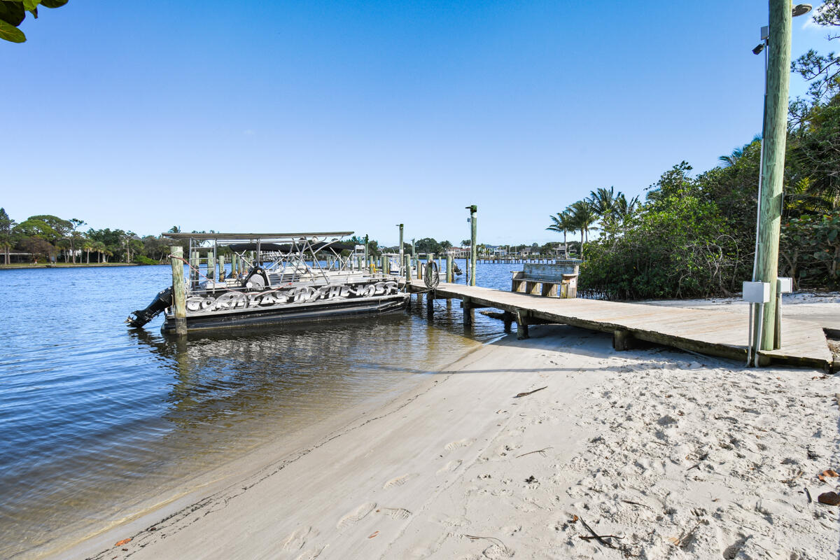 4835 Bimini Road Jupiter, FL 33469 - Photo 34 of 37 a view of a lake with houses