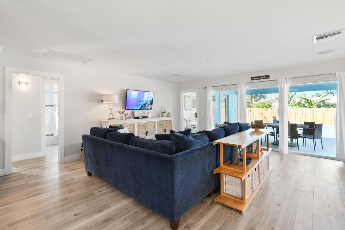 4835 Bimini Road Jupiter, FL 33469 - Photo 5 of 37 a living room with furniture and a large window