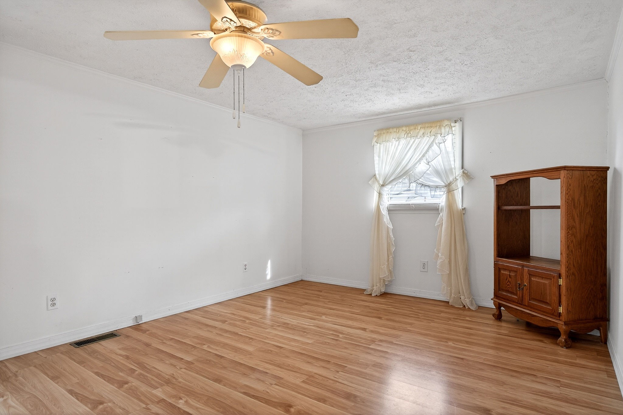 4463 Crisp Springs Road McMinnville, TN 37110 - Photo 11 of 26 wooden floor in an empty room with a window