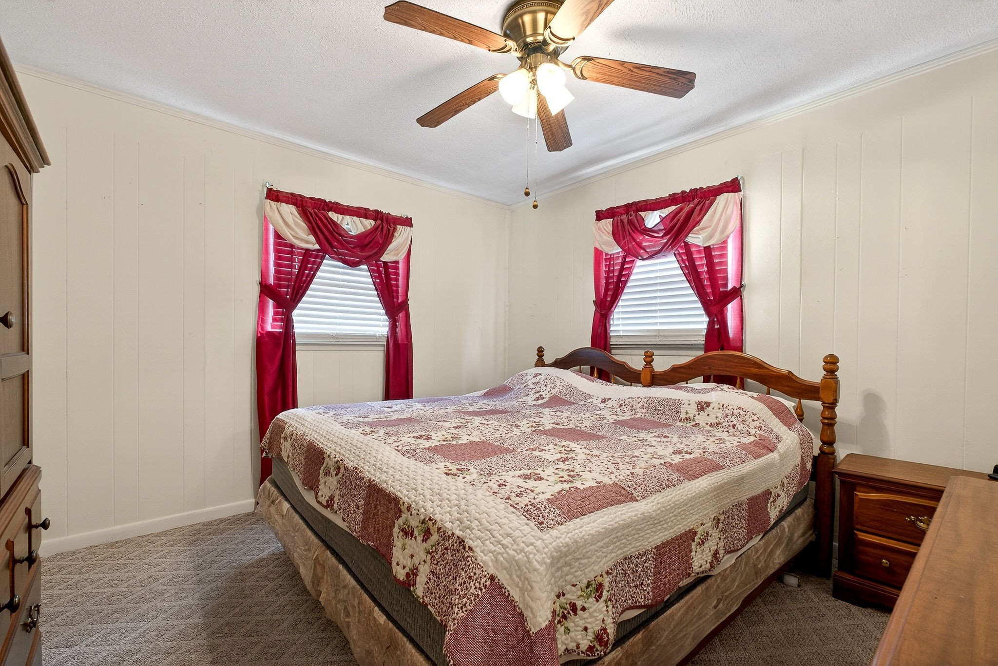 4463 Crisp Springs Road McMinnville, TN 37110 - Photo 15 of 26 a bed room with a bed and a chandelier